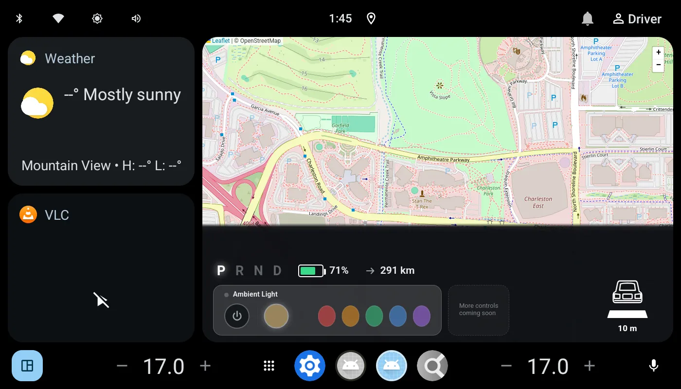 The Android Automotive 15 home screen running in Cuttlefish: map, weather and media cards, P-R-N-D gear indicator, battery range, ambient light controls and dual-zone climate bar
